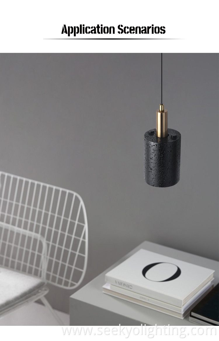 The black stone pendant lamp is designed to hang from the ceiling, providing ample lighting for the dining area below. The black stone pendant lamp is designed to hang from the ceiling, providing ample lighting for the dining area below.